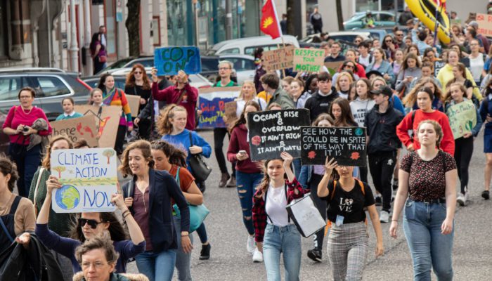 a group of people protesting concerning climate change
