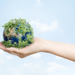 sustainable living environmentalist hand holding green earth