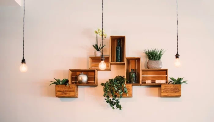 wooden wall decor with lamp and green plants